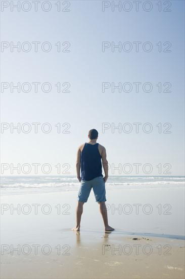 Man standing on beach. Date : 2008
