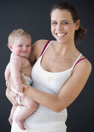 Mother holding baby. Date : 2008
