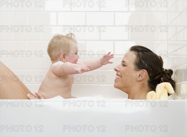 Mother and baby in bathtub. Date : 2008