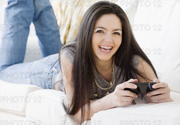 Woman playing videogame. Date : 2008