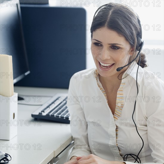 Businesswoman wearing headset. Date : 2008