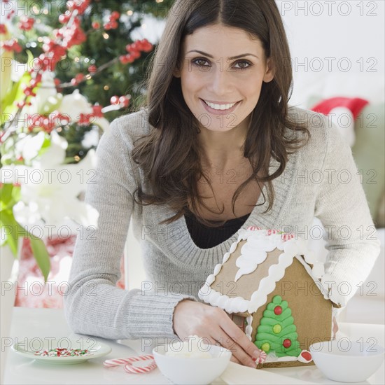 Woman making gingerbread house. Date : 2008