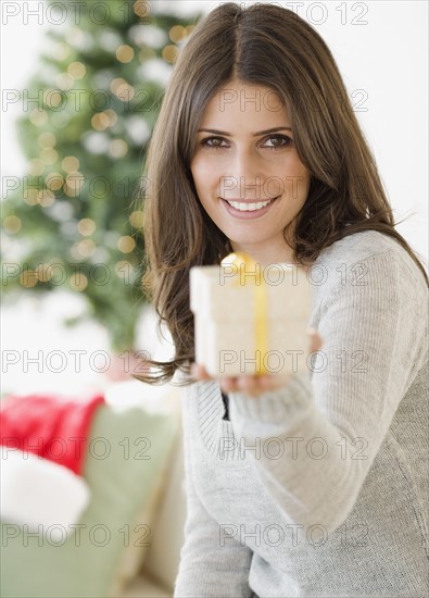 Woman holding gift on hand. Date : 2008