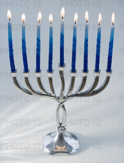 Close up of menorah with lit candles. Date : 2008