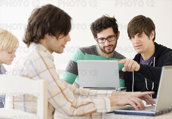 College students with laptops in classroom. Date : 2008