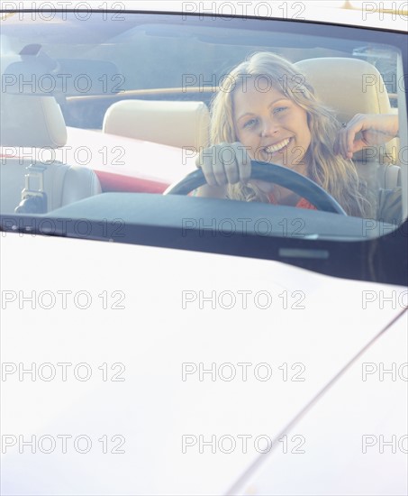 Woman driving car. Date : 2008