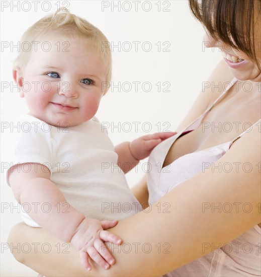 Mother smiling at baby. Date : 2008