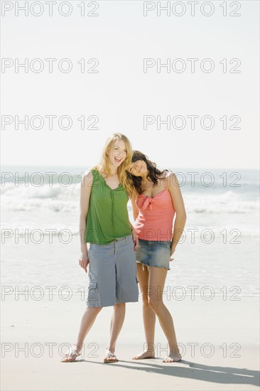 Two women standing on beach. Date : 2008