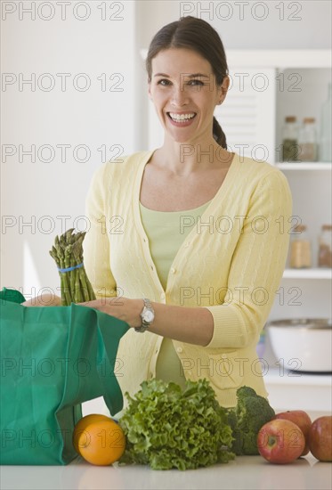 Woman unpacking groceries.