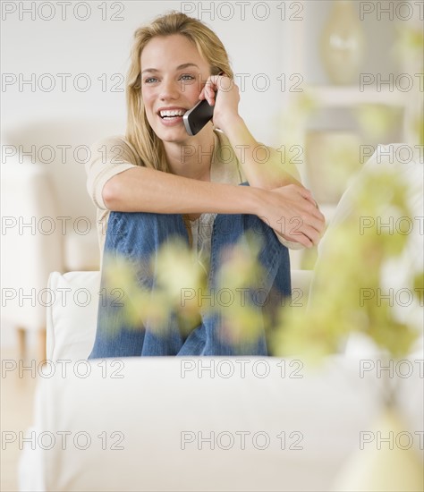 Woman talking on cell phone.