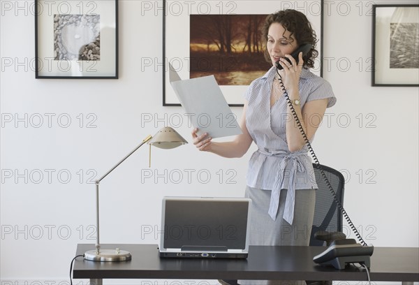 Businesswoman talking on telephone.