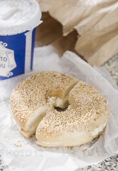 Close up of bagel and coffee. Date : 2008