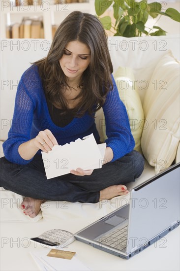 Woman opening mail. Date : 2008