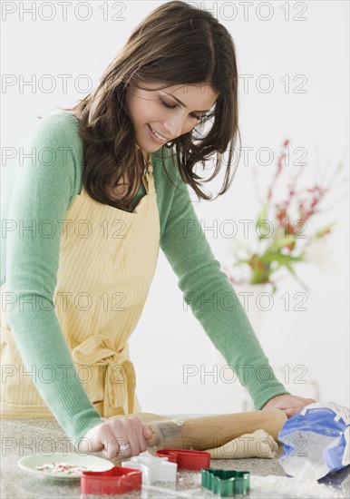 Woman rolling cookie dough. Date : 2008