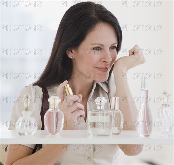 Woman sampling perfume.