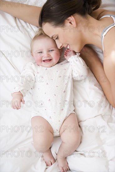 Mother smiling at baby. Date : 2008