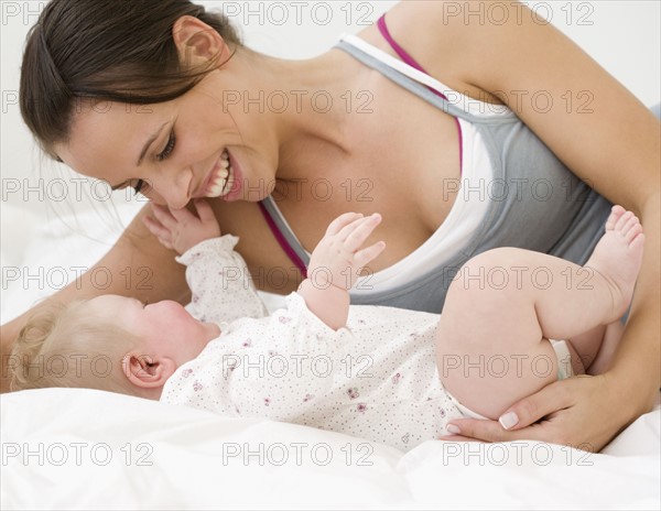 Mother smiling at baby. Date : 2008