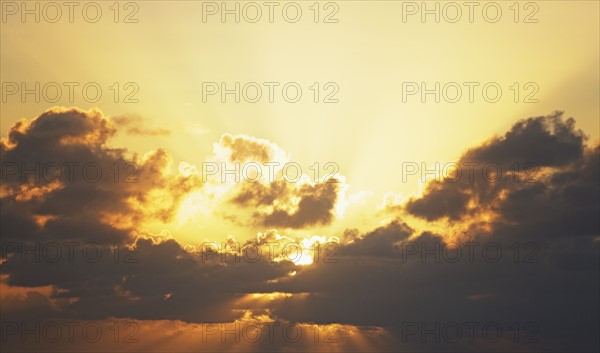 Sun shining through clouds. Date : 2008