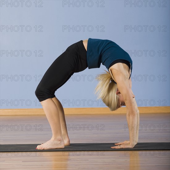 Woman practicing yoga. Date : 2008