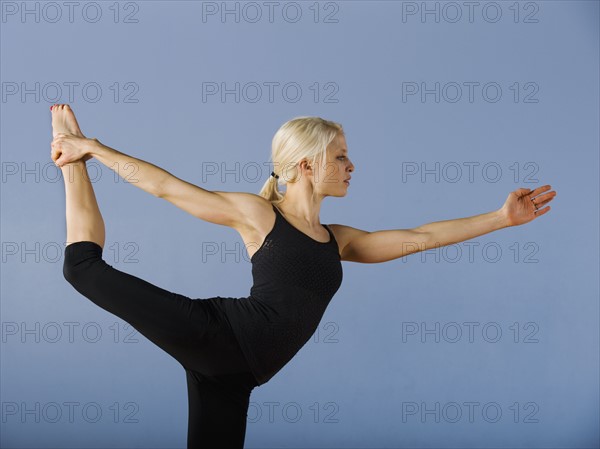 Woman practicing yoga. Date : 2008