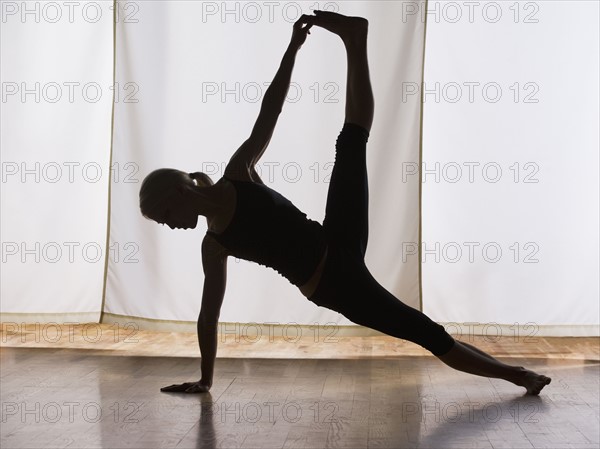 Woman practicing yoga. Date : 2008