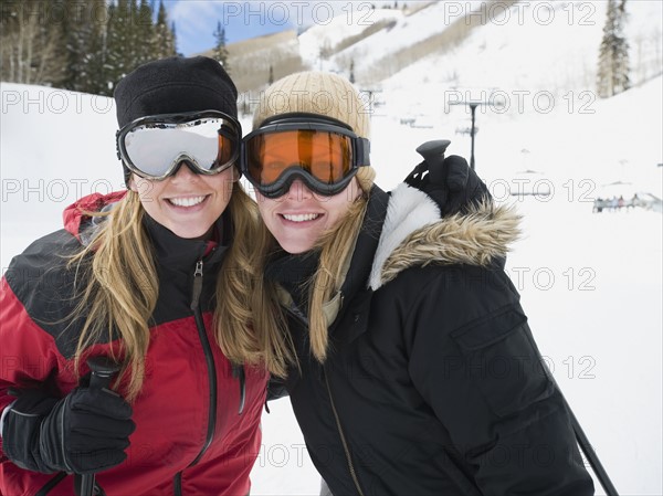 Woman in ski gear hugging. Date : 2008