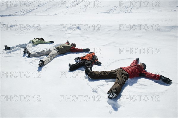 Family making snow angels. Date : 2008