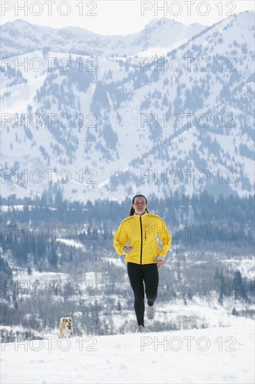 Woman running in snow. Date : 2008