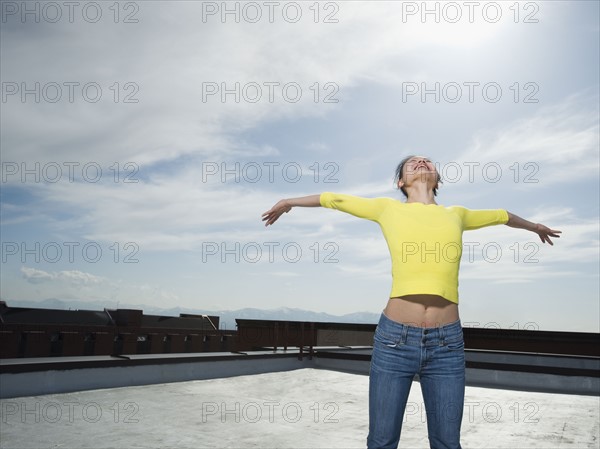 Woman with arm outstretched. Date : 2008