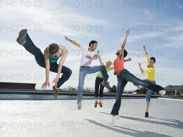 Multi-ethnic group performing modern dance. Date : 2008