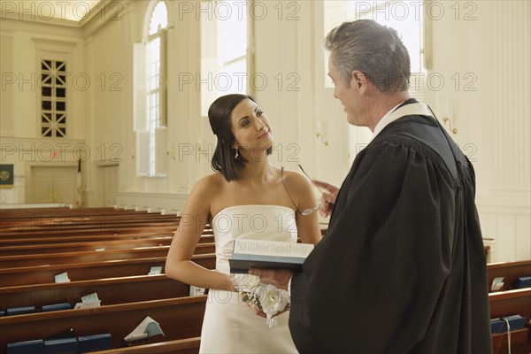 Priest talking to bride. Date : 2008