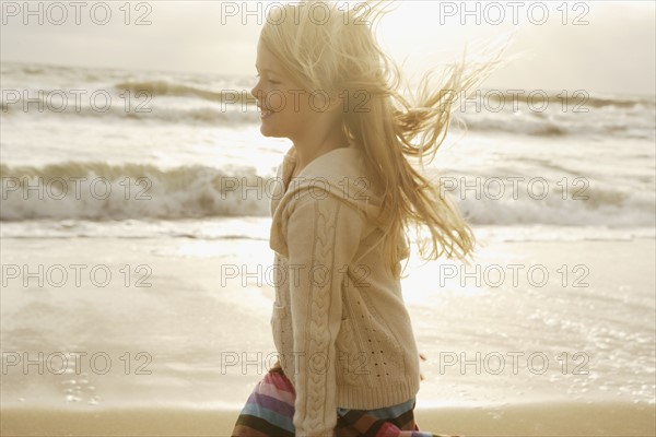 Girl in sunlight at beach. Date : 2008