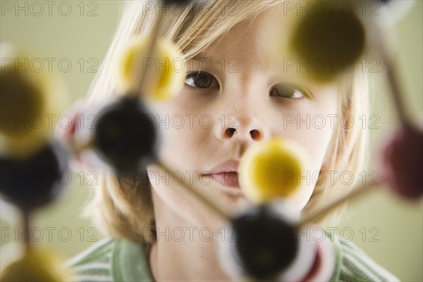 Boy looking at molecular model. Date : 2008