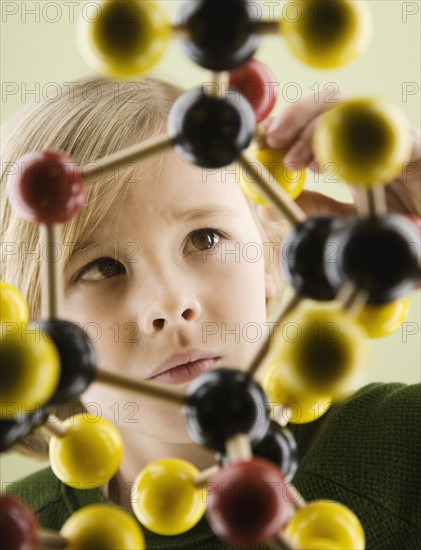 Boy looking at molecular model. Date : 2008