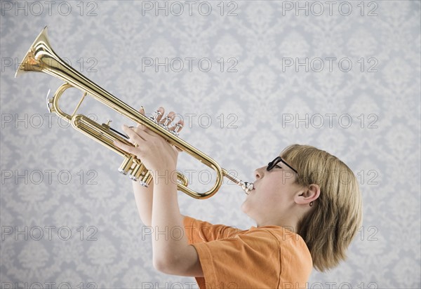 Boy playing trumpet. Date : 2008