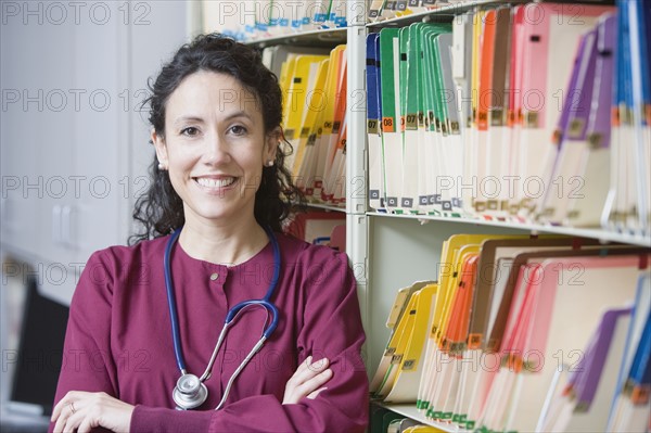 Female doctor next to charts. Date : 2008