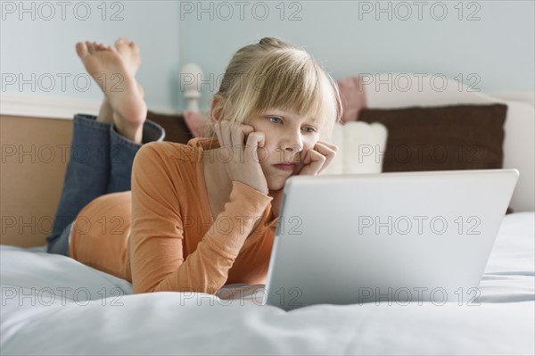 Girl looking at laptop. Date : 2008