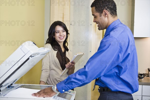 African businessman making photocopies. Date : 2008