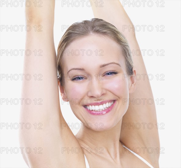 Woman stretching arms over head. Date : 2008