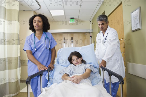 Girl being wheeling in hospital gurney. Date : 2008