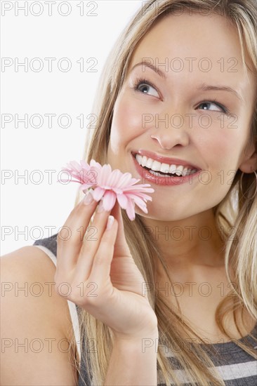 Woman holding flower. Date : 2008