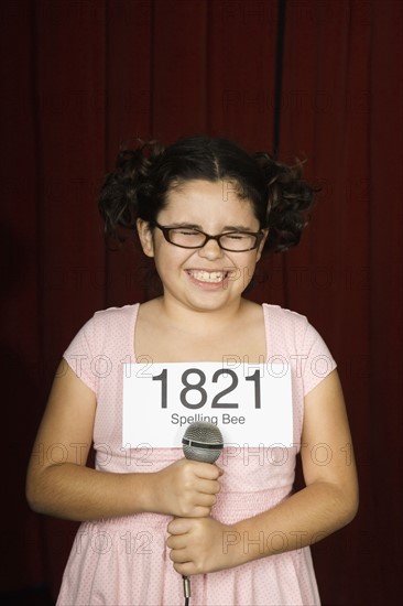 Girl wearing number on stage. Date : 2008