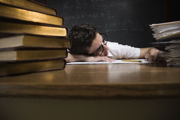 Nerdy man sleeping on school desk. Date : 2008