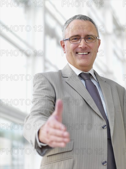 Businessman extending hand to shake. Date : 2008