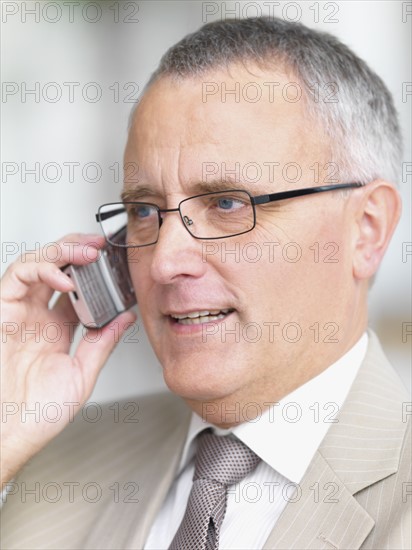 Businessman talking on cell phone. Date : 2008