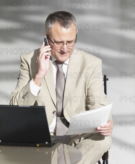 Businessman talking on cell phone. Date : 2008
