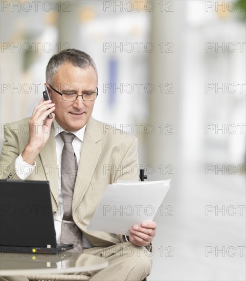 Businessman talking on cell phone. Date : 2008