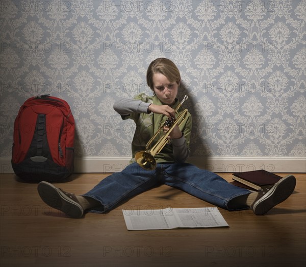 Boy holding trumpet. Date : 2008