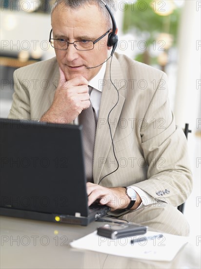 Businessman wearing headset. Date : 2008