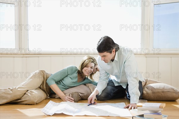 Couple looking at blueprints. Date : 2008